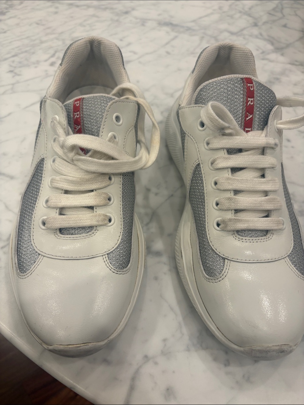 Prada White and Gray Kids Sneakers with Red Logo Stripe